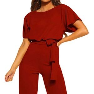 New, never been worn. Short-sleeve belted wide leg pantsuit. True to size.